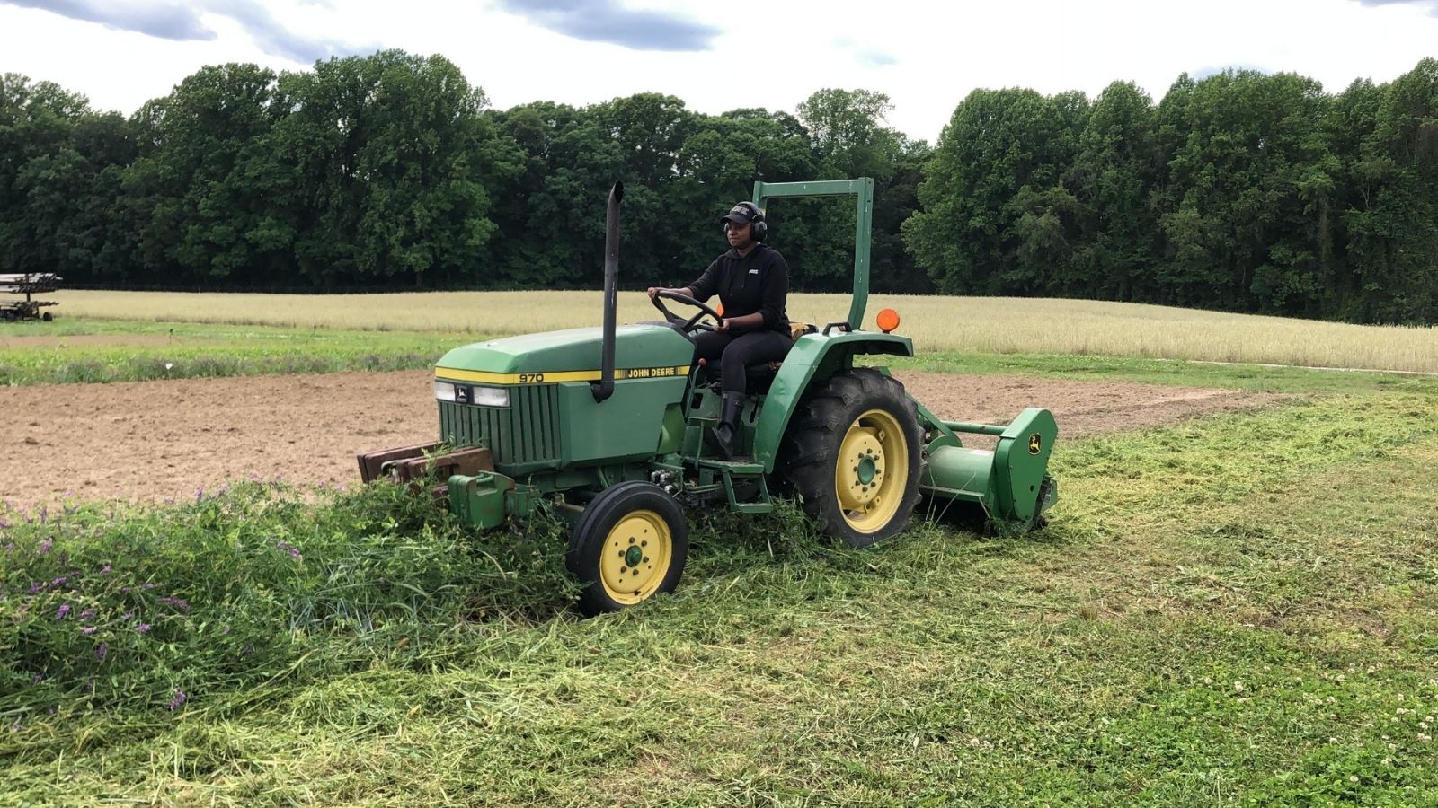 Ashley operating tractor